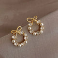 Hollow Out Round Rhinestones Bow Stud Earrings for Women Temperament Fashion Imitation Pearl Ear Studs Party Wedding Jewely K1